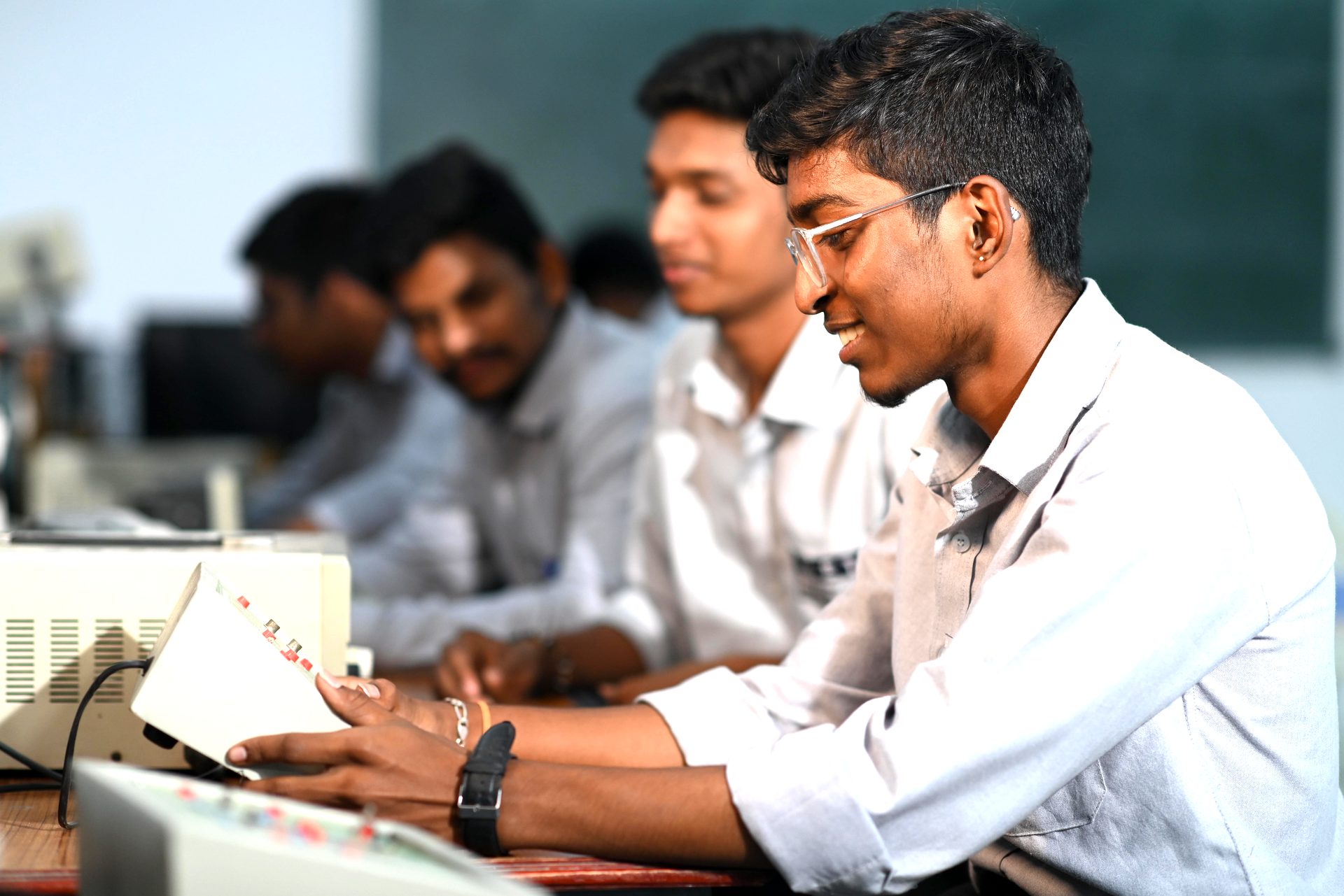 A student working on electronics lab equipment